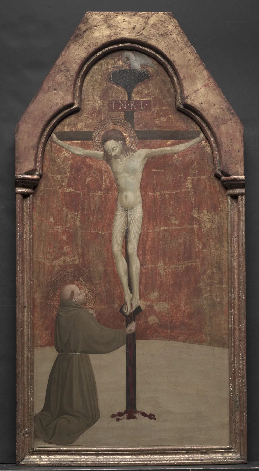 San Francisco arrodillado ante Cristo en la cruz, de Sassetta