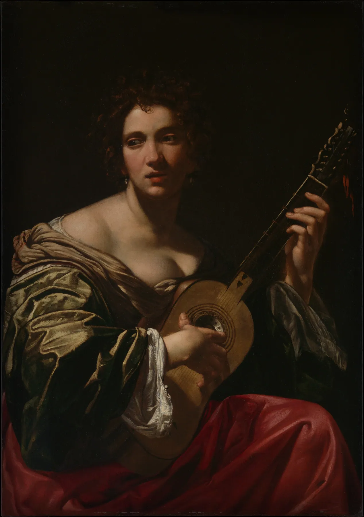 Mujer tocando la guitarra, de Simon Vouet